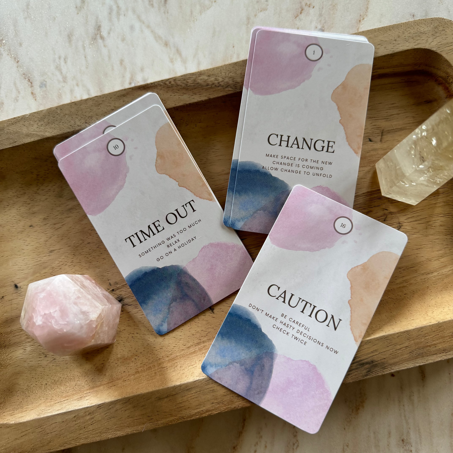 Oracle Cards and crystals on wooden plate