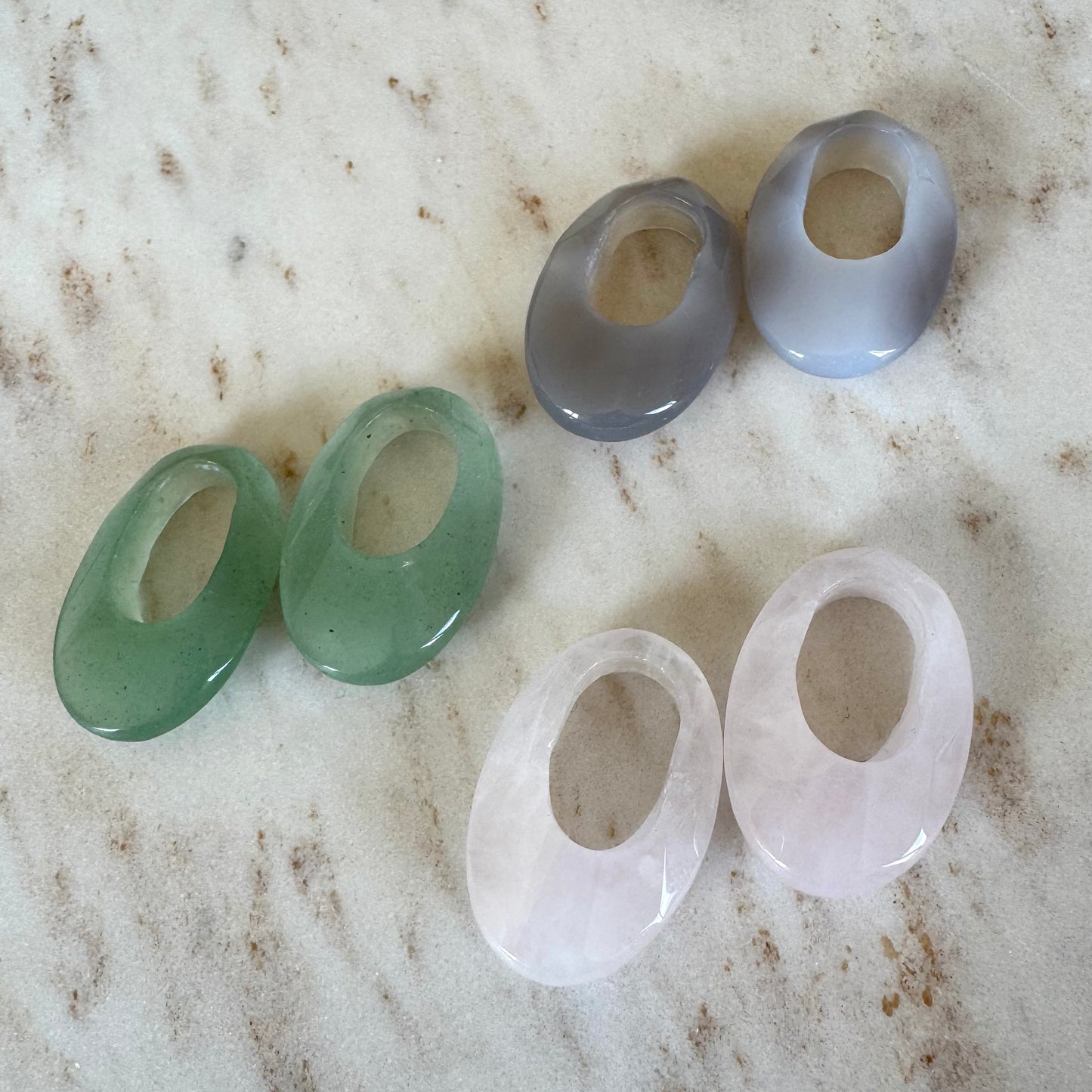 3 oval crystal pendant pairs in green gray and rose