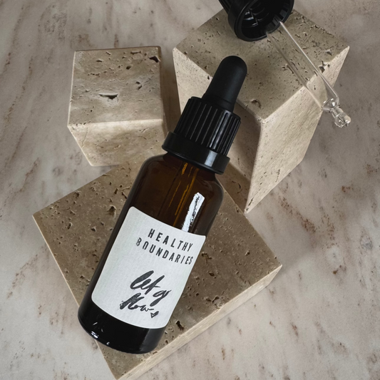 Ritualöl Gesunde Grenzen in braunem Fläschchen mit Pipette auf Marmor Präsentationsdisplay