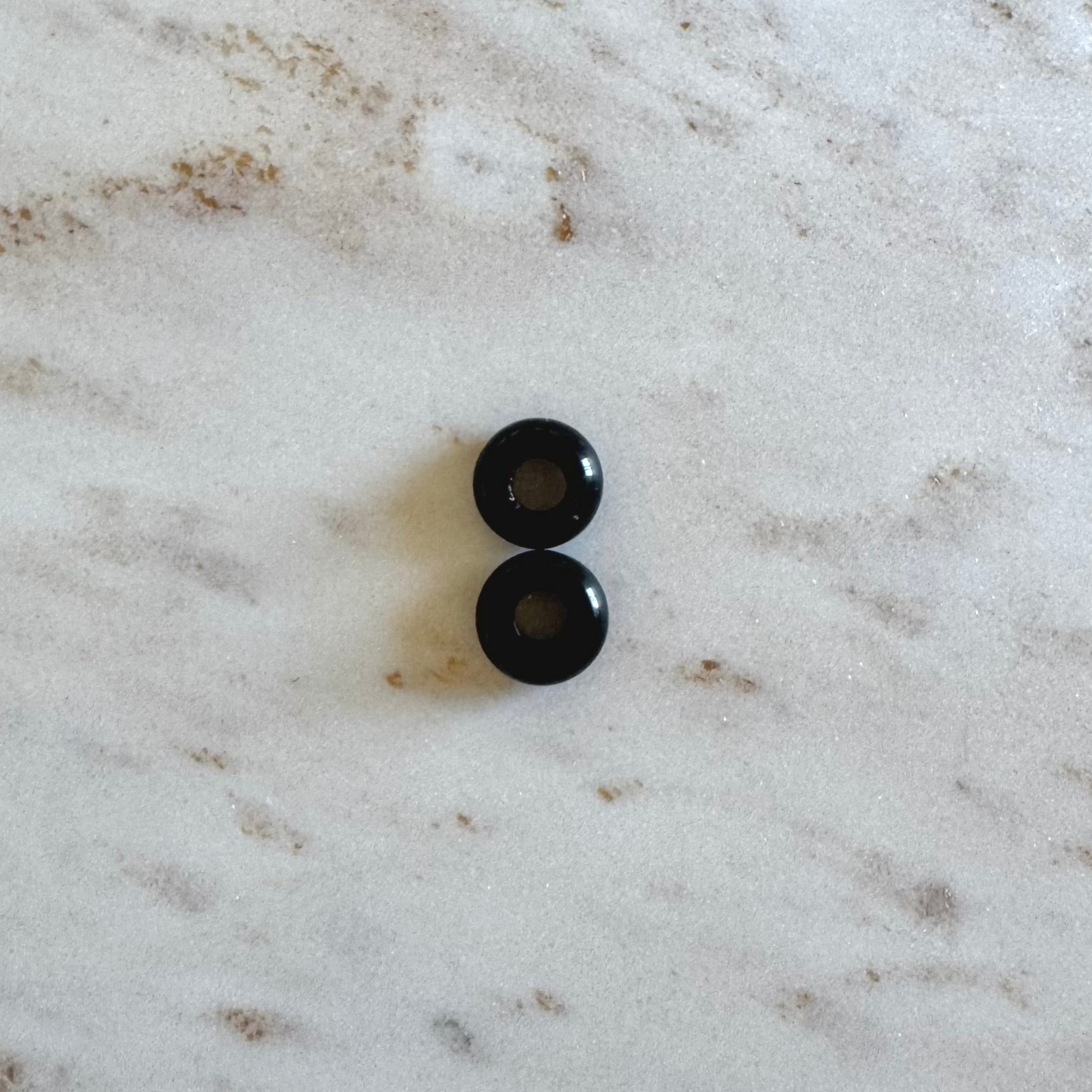 2 black obsidian donut shape pendants