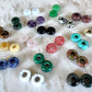 plenty of small donut shape crystal pendant pairs in different colors